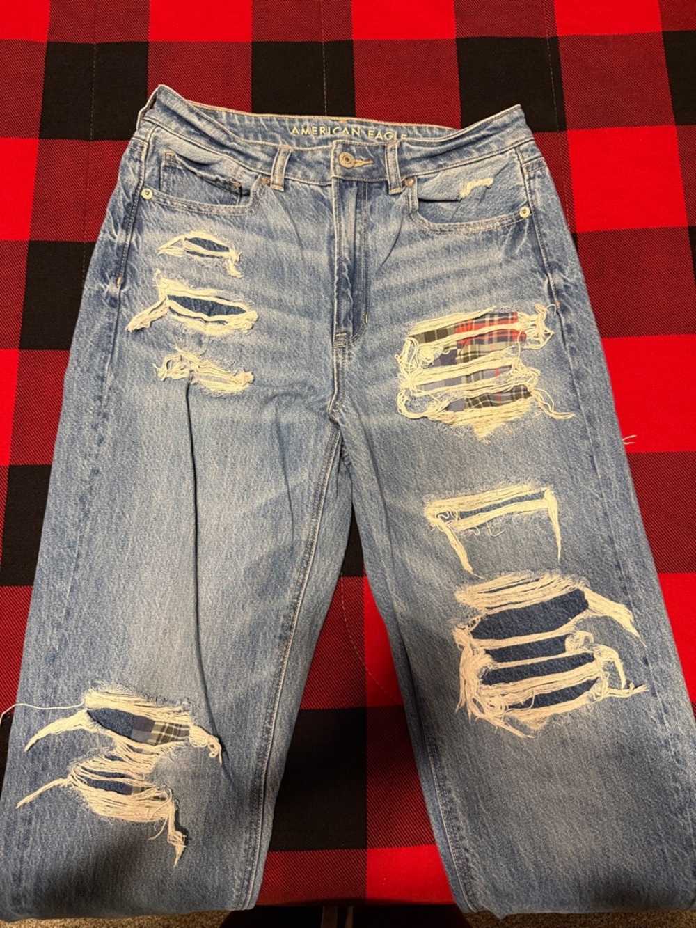 American Eagle Distressed Light Wash Jeans with Plaid Patch